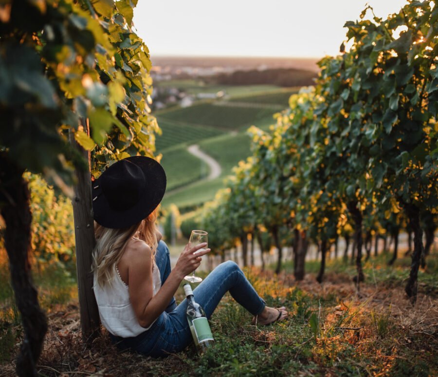 young-blonde-woman-relaxing-vineyards-summer-season-with-bottle-wine young-blonde-woman-relaxing-vineyards-summer-season-with-bottle-wine